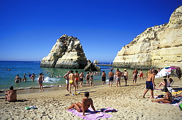 People on the beach in the sunlight, Praia da Rocha, Algarve, Portugal, Europe