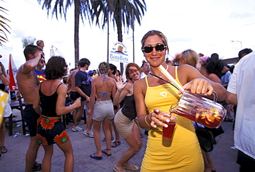 Young people in the Bora Bora Beach Disco, Club, Playa d'en Bossa, Ibiza, Spain