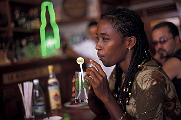 Young woman with drink at a bar, La Bodeguita del Medio, Havana, Cuba, Caribbean, America