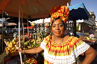 Woman wearing a traditional hat, Fruit vendor at the market, Pointe-a-Pitre, Grande Terre, Guadeloupe, Caribbean Sea, America