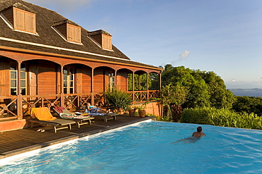 Relaxing in front of the pool of Hotel Le Jardin Malanga, Trois Rivieres, Basse-Terre, Guadeloupe, Caribbean Sea, America