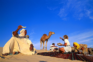 Picnic in the desert with Ben Ali, Dune landscape near Nefta, Tunesia