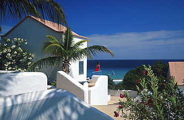 Woman at holiday home with seaview, Sotavento, Jandia, Fuerteventura, Canary Islands, Spain, Europe