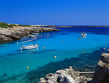Sailing boats in the bay, Cala de BinisafË™ller, Minorca, Spain
