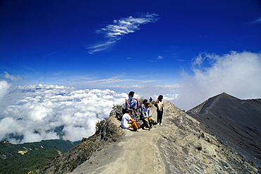 People at the border of the basic crater of volcano IrazË™, Costa Rica, Central America, America