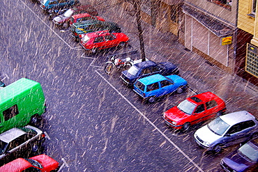 Snowfall in Berlin with parked cars, Neukoelln, Berlin, Germany