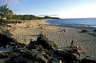 People sunbathing on Boucan Canot beach, La RÃˆunion, Indian Ocean