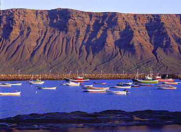 Fishing boats in the harbour, Famara Lanzarote of Caleta del Sebo, La Graciosa, Canary Islands, Spain