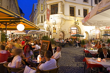 People at the sidewalk cafe Till`s Tunnel in the evening, Drallewatsch, Leipzig, Saxony, Germany, Europe