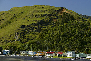 Holiday homes on the waterfront of Coromandel Peninsula, North Island, New Zealand, Oceania