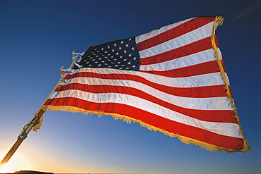 American Flag, Stars and Stripes against a blue sky, USA