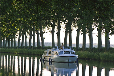 Woman ob houseboat, Canal du Midi, France