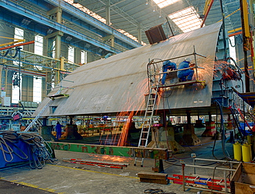 Welding steel plates, dry dock, Queen Mary 2, Saint-Nazaire, France