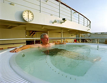 Mature man relaxing in a whirlpool, Cruise ship Queen Mary 2