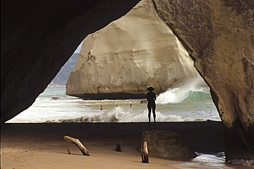 People on the beach in Cathedral Cave at Coromandel Peninsula, North Island, New Zealand, Oceania