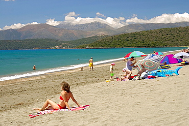 People on the beach near Gythio, Peloponnese, Greece