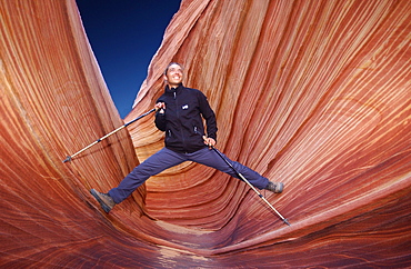 Man hiking through Coyote Butes, Arizona, USA