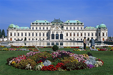 Flower beds in front of Belvedere castle under blue sky, Vienna, Austria, Europe