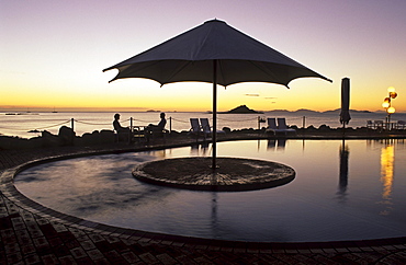 Sunset at pool, Brampton holiday Island resort, Brampton Island, Great Barrier Reef, Queensland, Australia