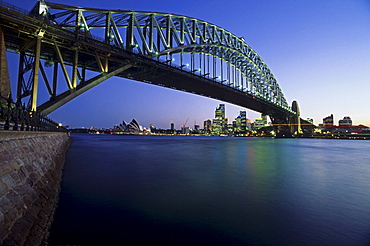 View below the Sydney Harbour Bridge across the harbour to the Opera House, Sydney, Australia