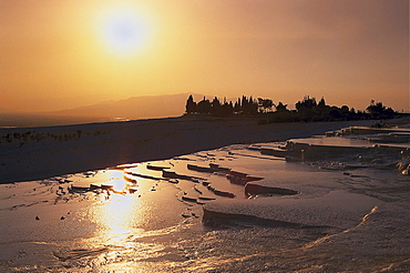 Sunset over the limestone sinter terraces, Pamukkale, Denizli, Turkey