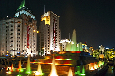 fountain in front of Peace Hotel, the Bund at night, Shanghai, China