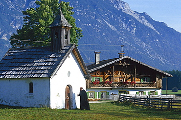 Priest locking his chapel, Tyrol, Austria