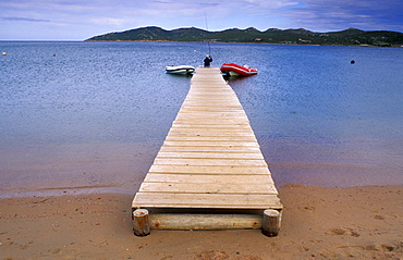 One fisherman at the landing stage, Santa Amanza, Plage de Maora, Bonifacio, Corsica, France