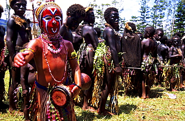 Child with drum at the Hulli Sing Sing festival, Mt Hagen, Eastern Highlands, Papua New Guinea, Melanesia