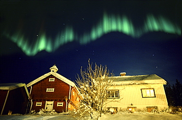 Northern lights above traditional wooden house, Lillehammer, Norway, Scandinavia, Europe