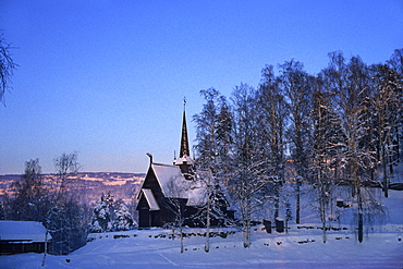 Garmo stave church in snow covered scenery, Maihaugen, Lillehammer, Norway, Scandinavia, Europe