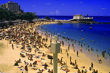 People at Barra beach in the sunlight, Forte da Barra, Salvador da Bahia, Brazil, South America, America