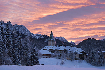 Ellmau castle in winter at sunset, burned down August 2005-rebuilding in 2007, Werdenfelser Land, Upper Bavaria, Bavaria, Germany