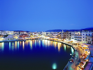 Illuminated Venetian Harbour at night with restaurants, Chania, Crete, Greece