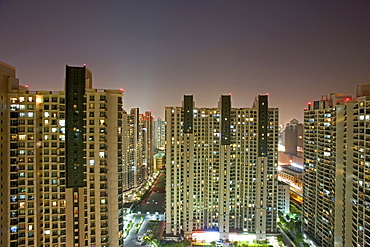 apartment towers, living in Shanghai, highrise apartments, near Souzhou Creek, windows, night