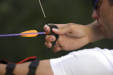 Archer taking aim at target