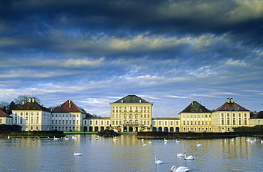 Europe, Germany, Bavaria, Munich, Nymphenburg Palace, swans on the Nymphenburg canal in front of the Palace