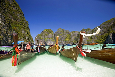 Boats anchoring in the Maya Bay, a beautiful scenic lagoon, famous for the Hollywood film "The Beach", Ko Phi-Phi Leh, Ko Phi-Phi Islands, Krabi, Thailand, after the tsunami