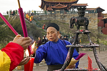 pilgrims and tourists burning incense sticks and candles, 3077 metre altitude, Golden Summit, summit of Emei Shan mountains, World Heritage Site, UNESCO, China, Asia