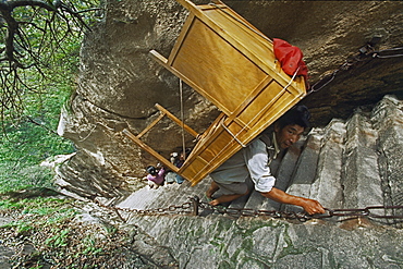 porter, porters carry furniture, building material on his back up steep mountain steps, Taoist mountain, Hua Shan, Shaanxi province, Taoist mountain, China, Asia