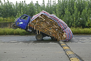 Heavy load, overloaded three-wheeler, China, Asia