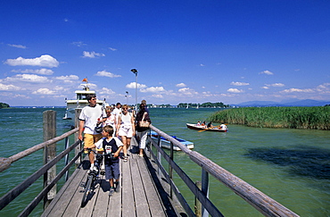 Landing stage at Herrenchiemsee island with view towards Frauenchiemsee island, Lake Chiemsee, Chiemgau, Upper Bavaria, Bavaria, Germany