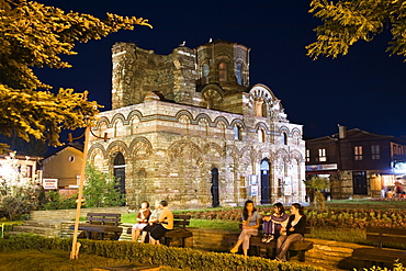 People in front of Jesus Christ Pantocrator church at night, Nesebar, Black Sea, Bulgaria, Europe