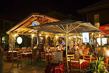 People at a restaurant at night, Town museum Nesebar, Black Sea, Bulgaria, Europe