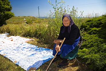 Peasant woman selling handicraft, Muselievo, Bulgaria, Europe