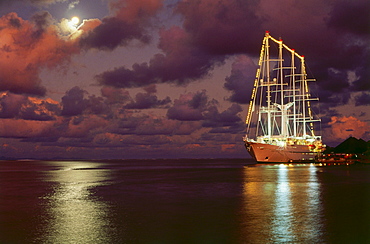 Cruiser Windsong in fullmoon night, Uturoa, Raiatea, French Polynesia