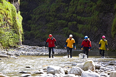 Canyoning at the swimm- and hike Canyon Raebloch, canton Bern, Switzerland. A group of people are floating in wetsuits . The river Emme has erodet a 50 meter deep canyon into the rocks. It's a swim- and hiking canyon. Emmental, Europe, MR