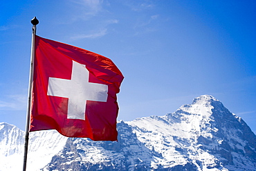 Eiger (3970 m) and Swiss flag, Grindelwald, Bernese Oberland (highlands), Canton of Bern, Switzerland