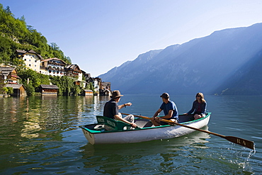 People in a rowboat on Lake Hallstatt, Hallstatt, Salzkammergut, Upper Austria, Austria