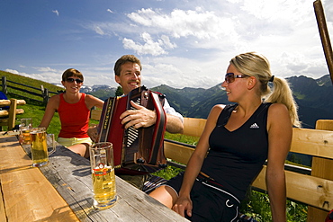 Man playing accordion, Bichlalm (1731 m), Grossarl Valley, Salzburg, Austria